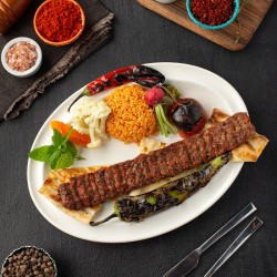 Adana Kebap [ Kuzu ve dana zırh kıyması,isot,pulbiber, pilavı ile servis edilir. ]